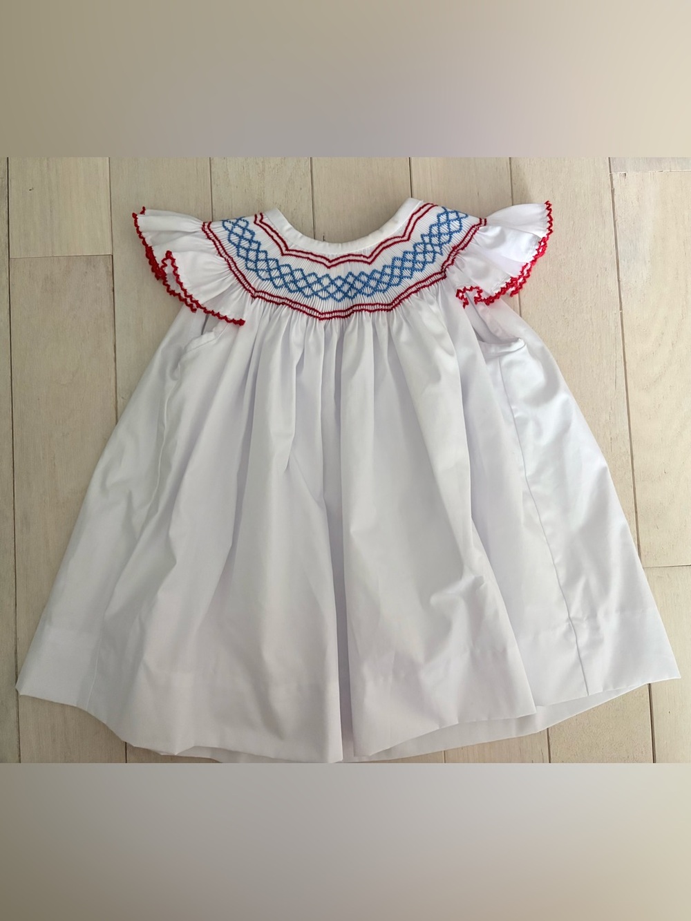 The Beaufort Bonnet Company White Smocked Dress with Red and Blue Trim